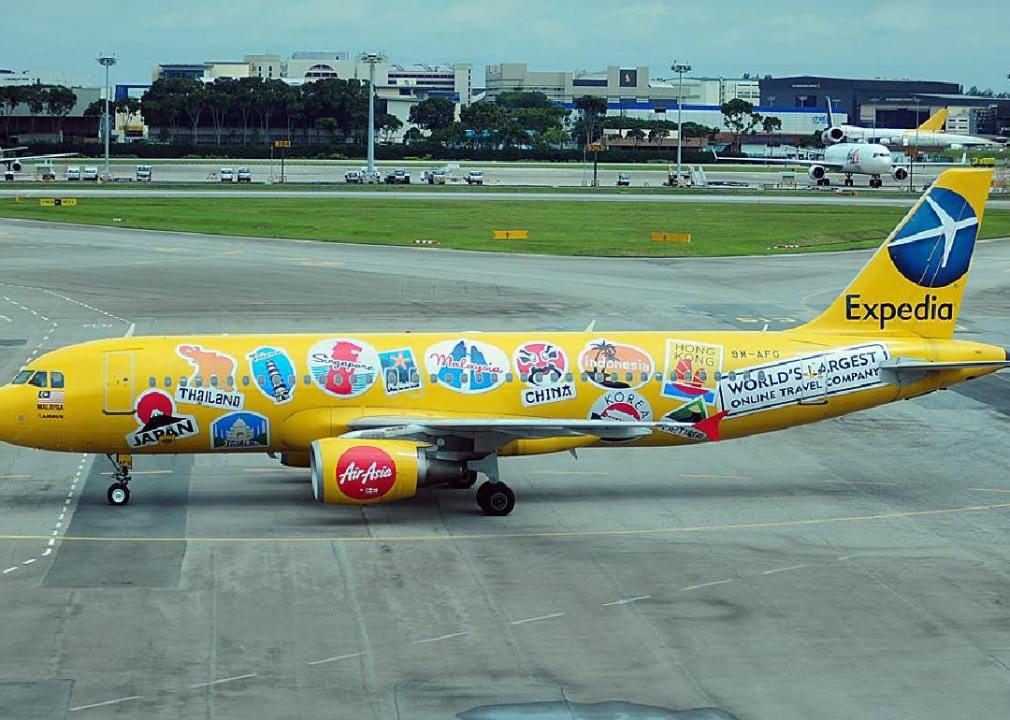 Yellow stationary Expedia airplane.