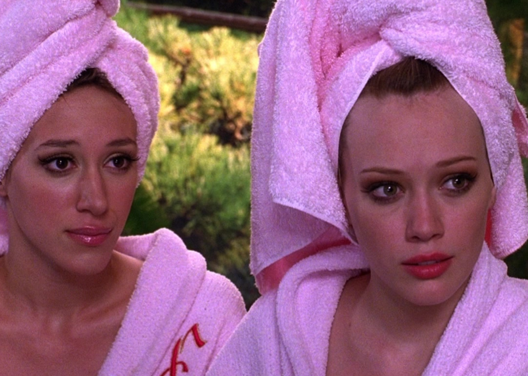 Hilary Duff and Haylie Duff in pink robes and hair towels.