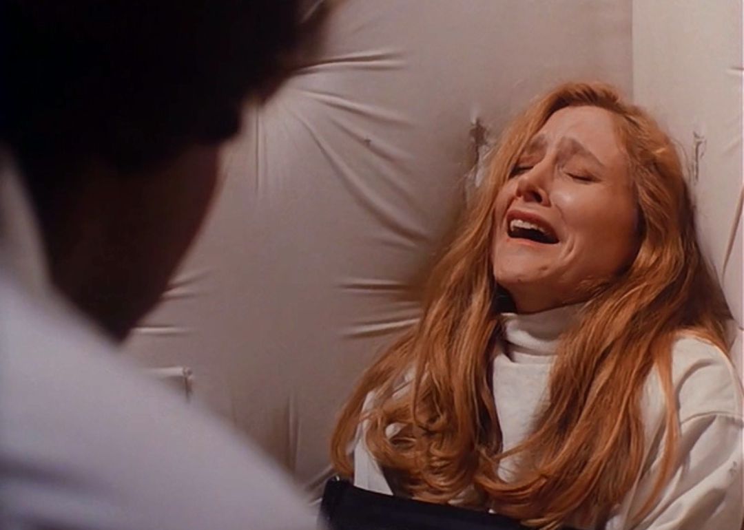 Patricia Clarkson tied up in a padded room.