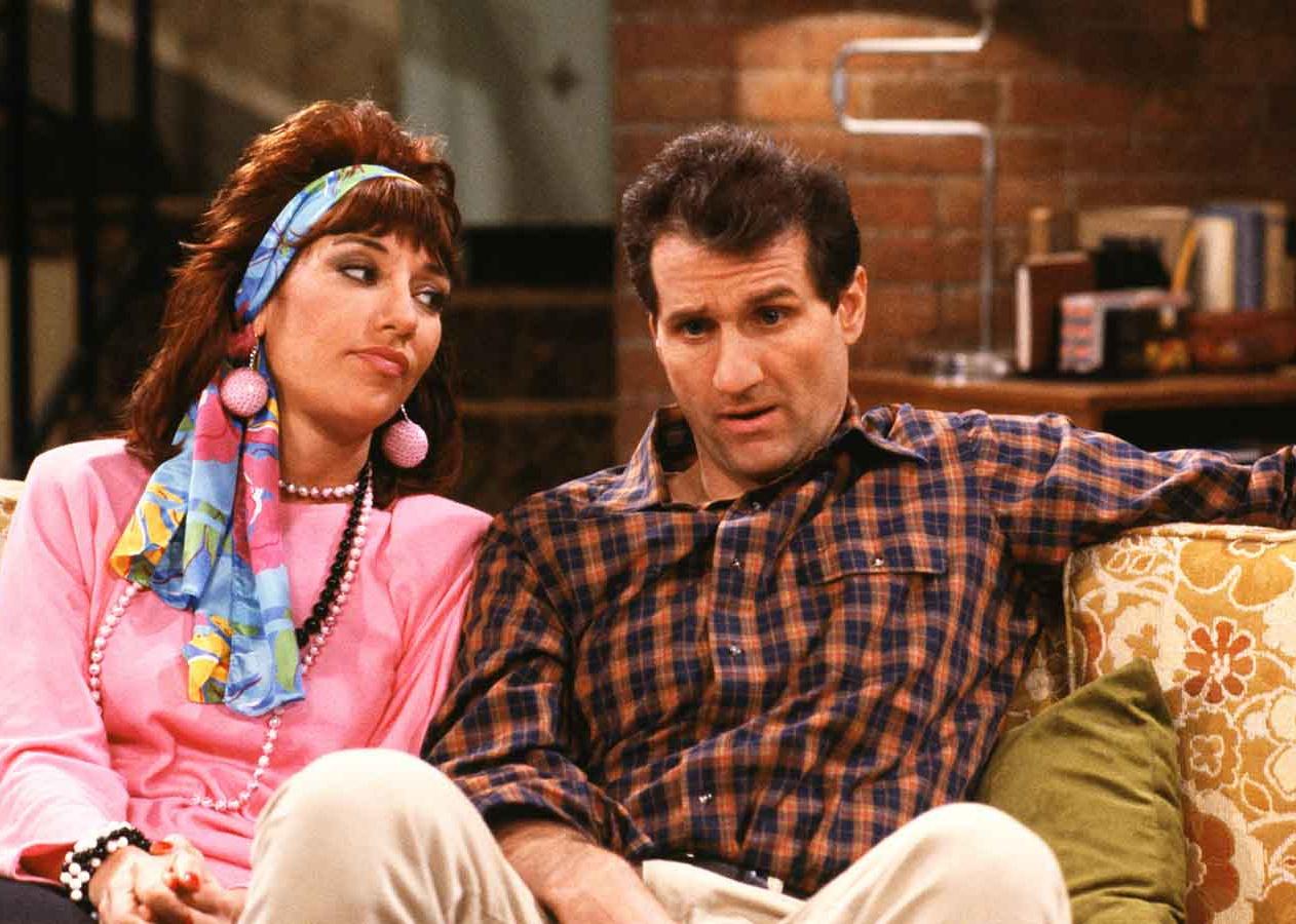 Katey Sagal and Ed O'Neill's characters sitting on a couch.
