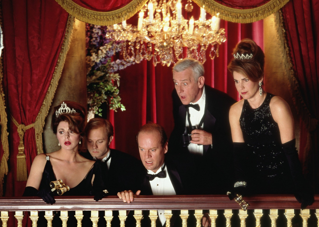 The cast of Frasier on an opera balcony looking down.