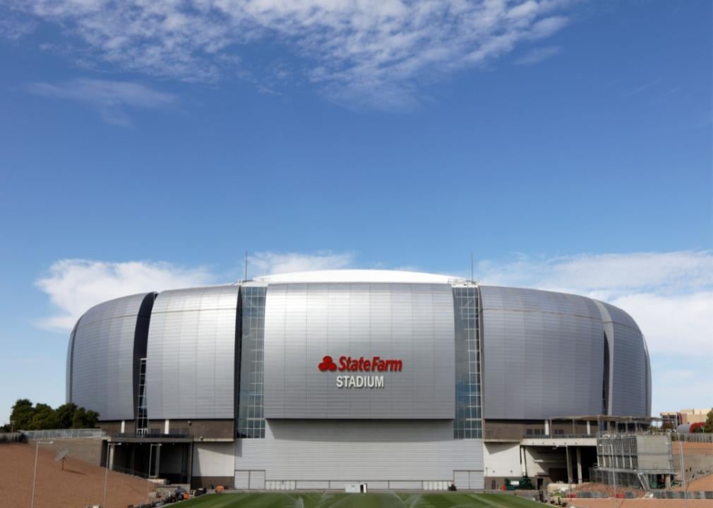 State Farm Stadium from the outside showing it's round silver exterior.