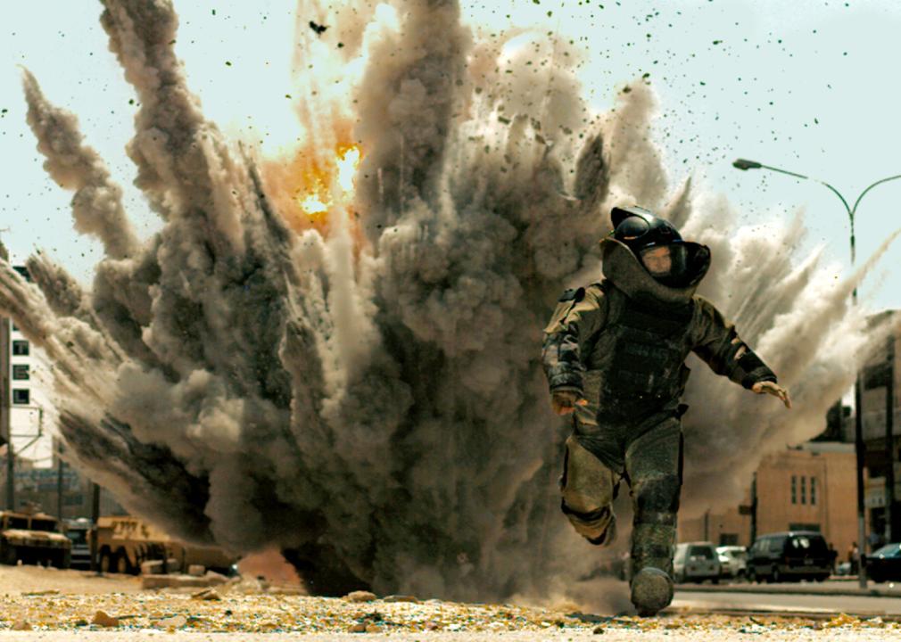 Guy Pearce running from an explosion.