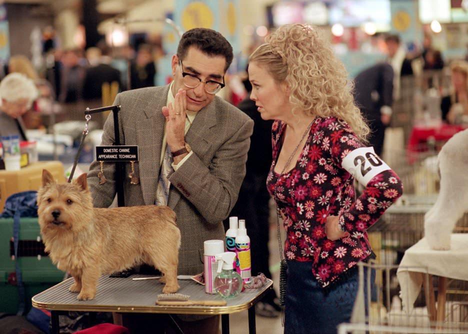 Catherine O'Hara and Eugene Levy talk in front of a little dog before a show.