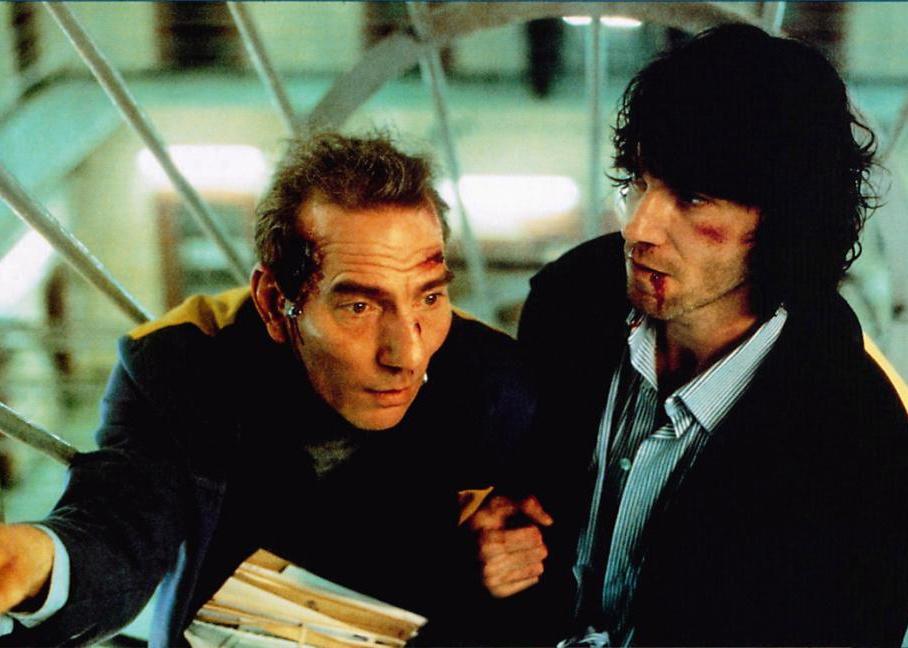 Daniel Day-Lewis and Pete Postlethwaite with bloodied faces.