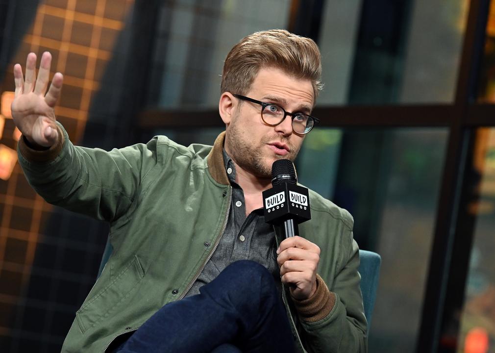 Adam Conover on stage in NY.