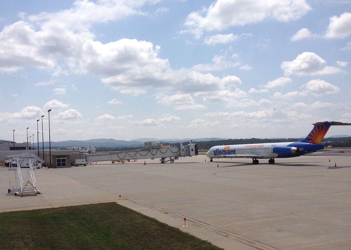 An airplane pulls up to a jetbridge at Asheville Regional.