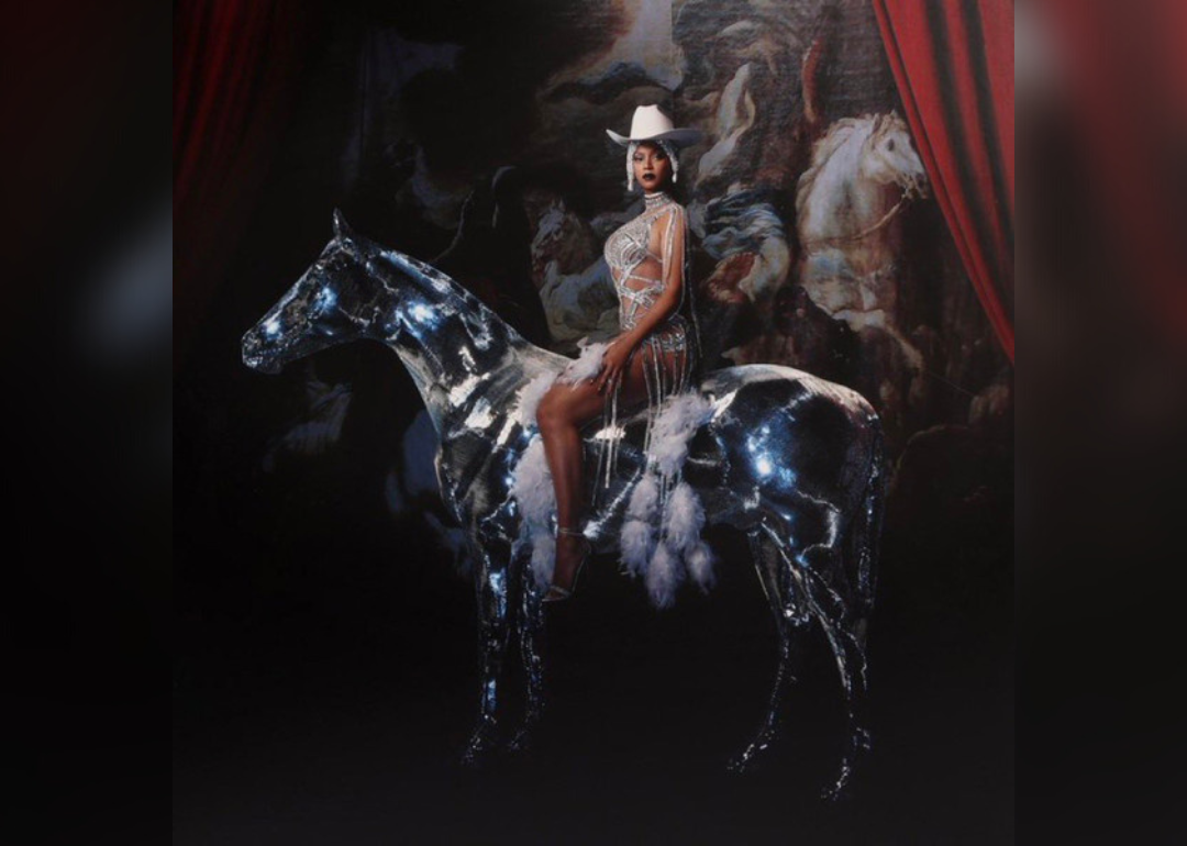 Beyonce adorned in jewels atop the silhouette of a luminous horse.