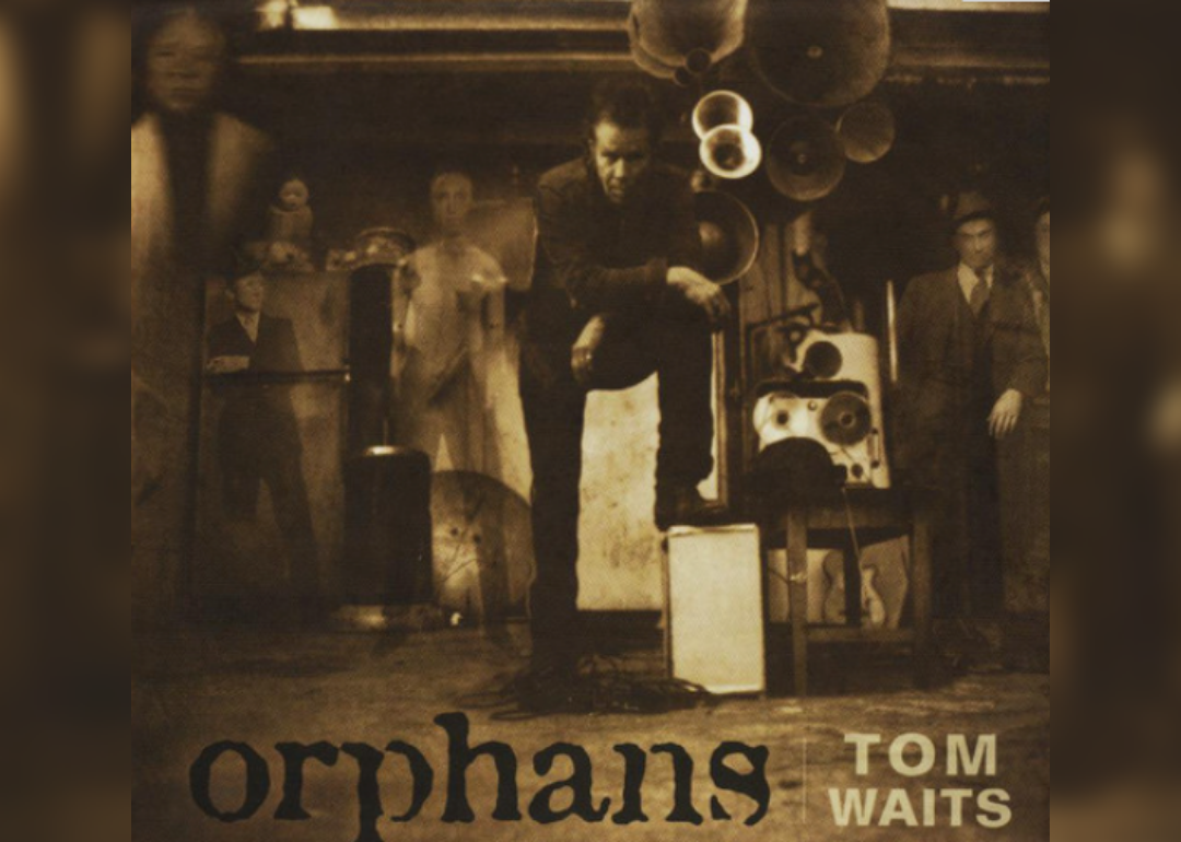 A fuzzy Tom Waits in Sepia tone with ghostlike figures in the background.