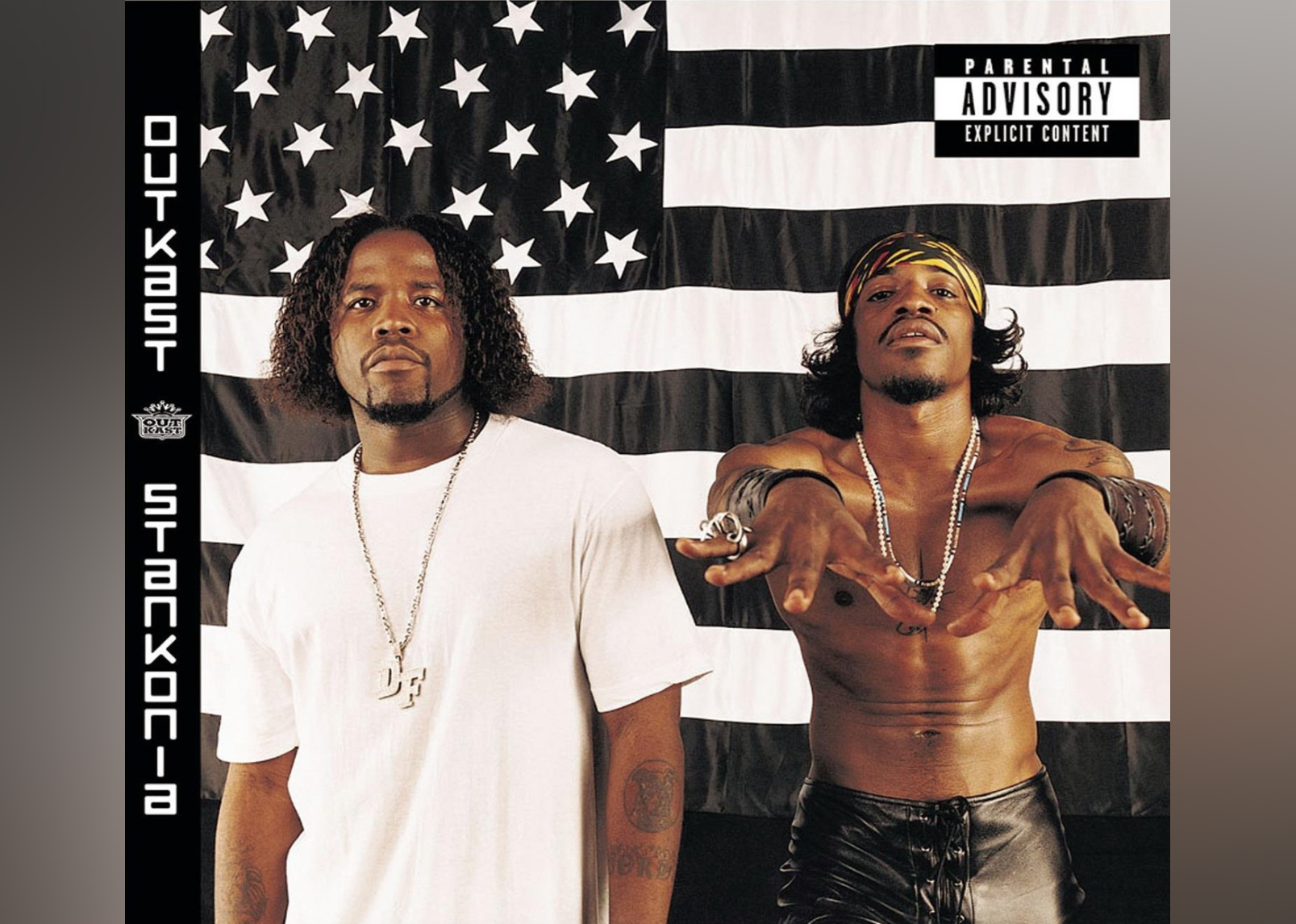 Big Boi and Andre 3000 in front of a black and white American flag.