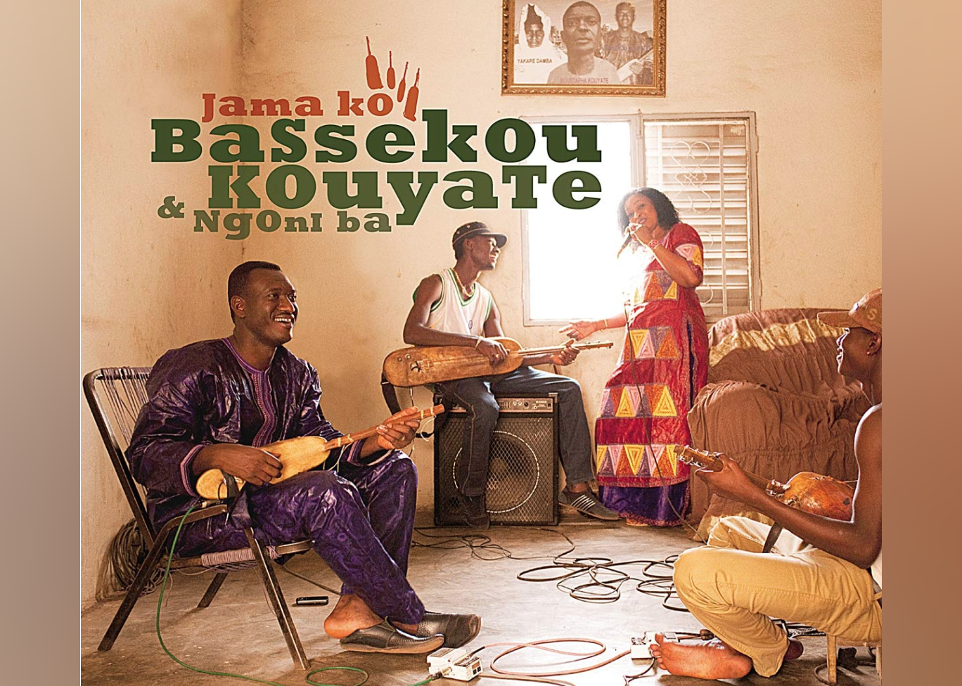 Bassekou Kouyate & Ngoni Ba having a jam session in a living room.