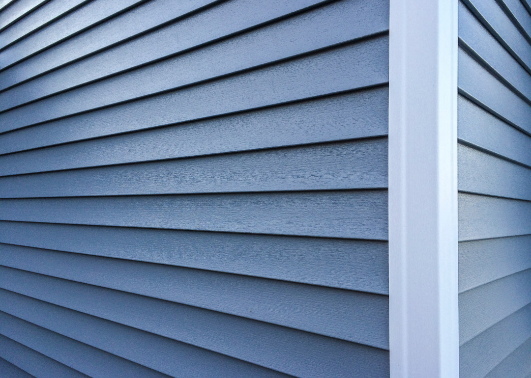 Blue vinyl siding on a house.