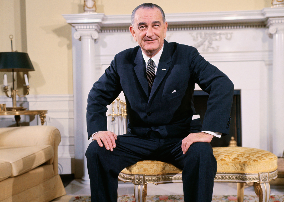 Lyndon B. Johnson sitting in a chair in the White House.