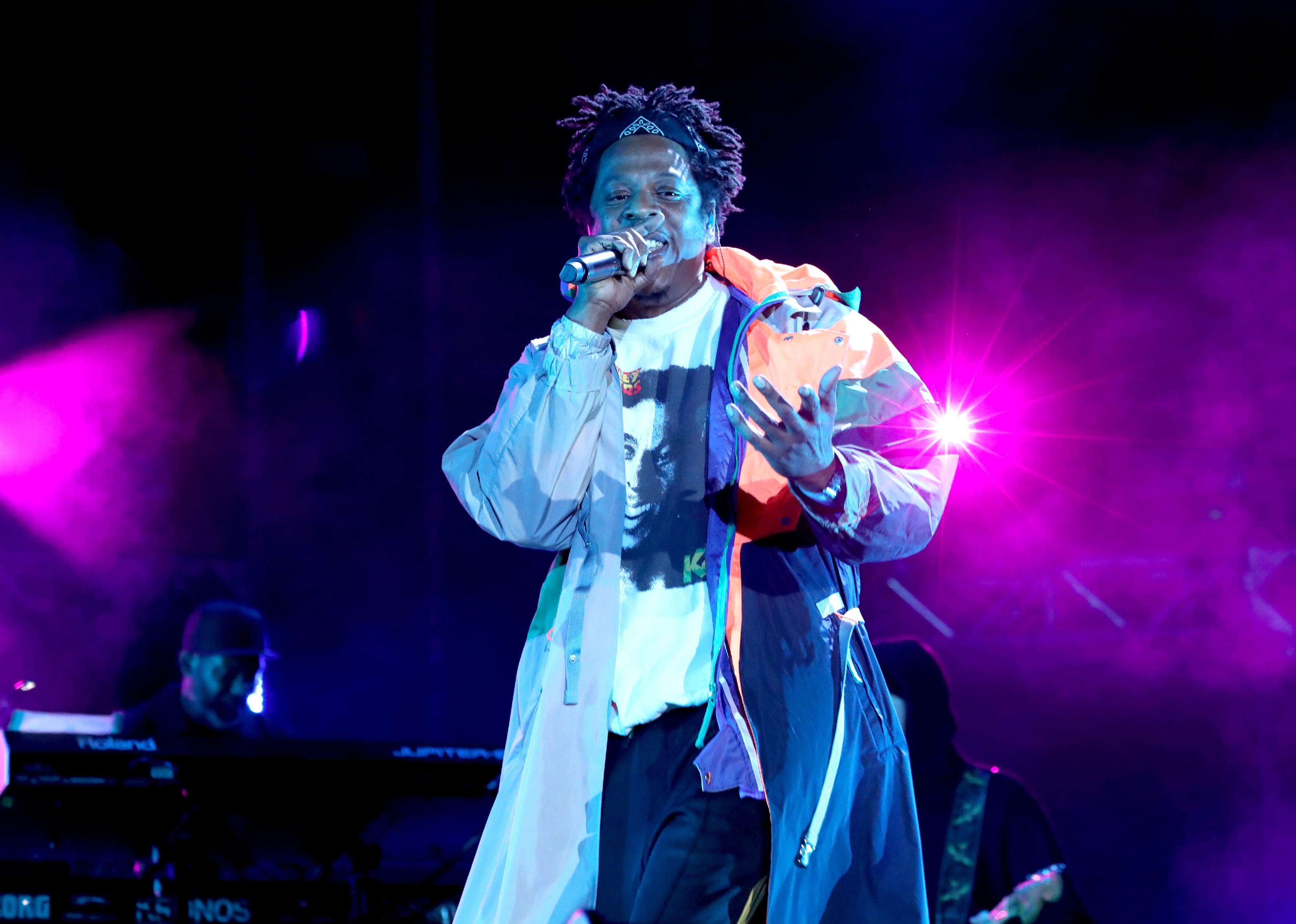 Jay-Z onstage in a Bob Marley shirt.