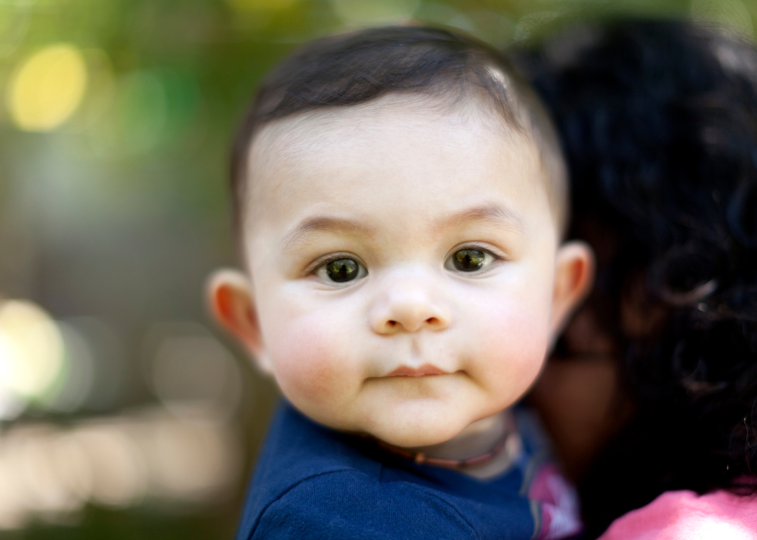 A baby boy in a blue shirt.