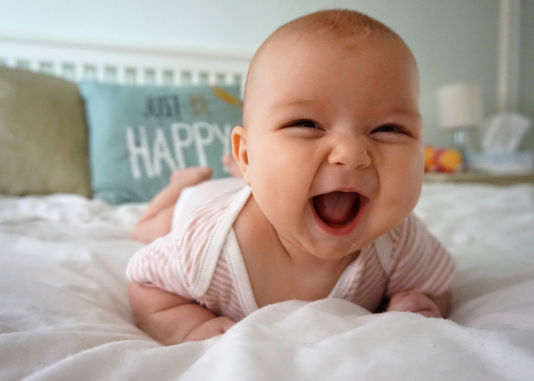 A baby girl laughing.