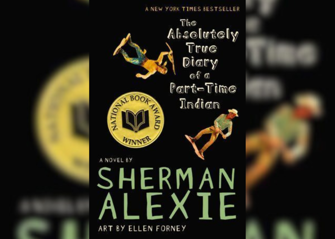 A black background with small cowboy and indian figurines.