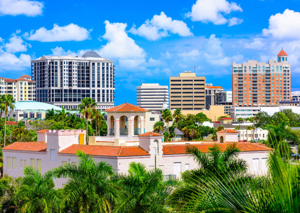 Aerial view of downtown Sarasota buildings and palm trees.