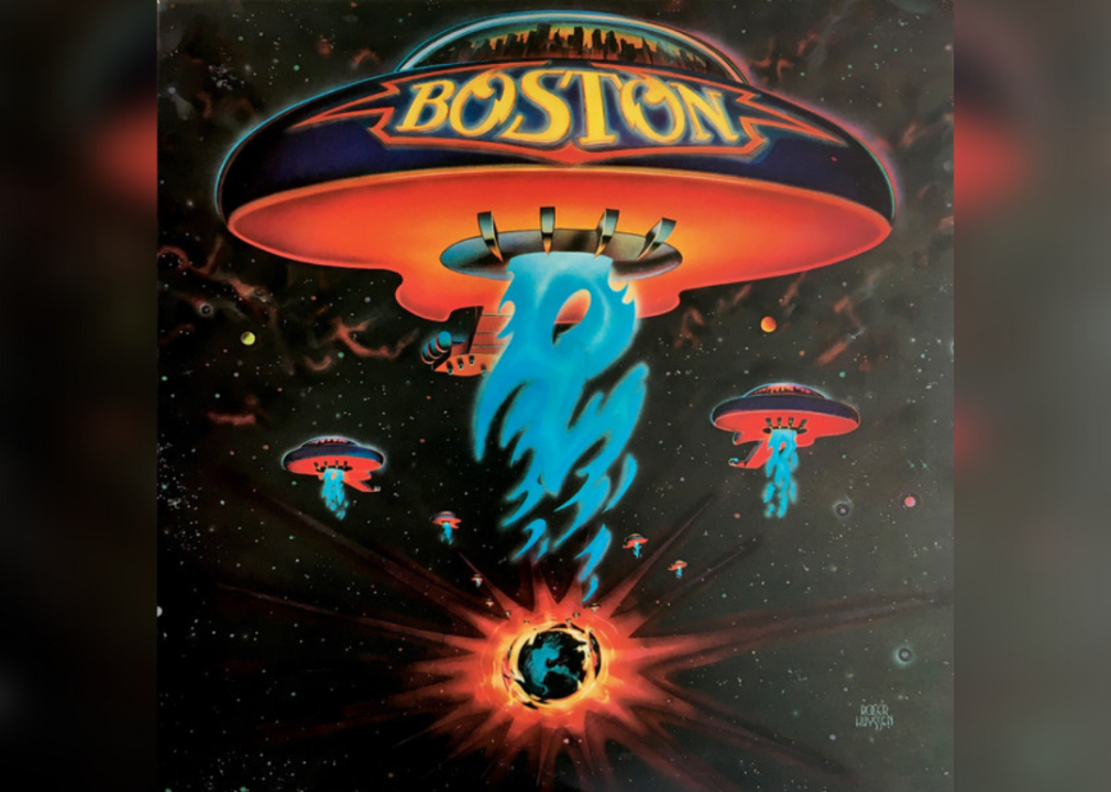 Boston spaceship in outer space with blue flames coming out of the bottom.