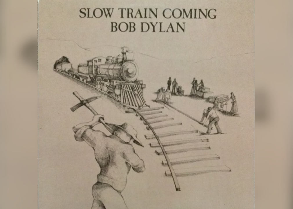 Black and white drawing of a train coming as the tracks are being built.
