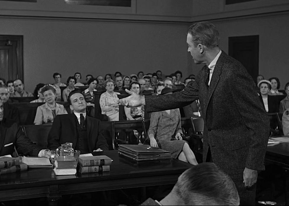 Actor James Stewart stands in front of the courtroom in a scene from ‘Anatomy of a Murder.'