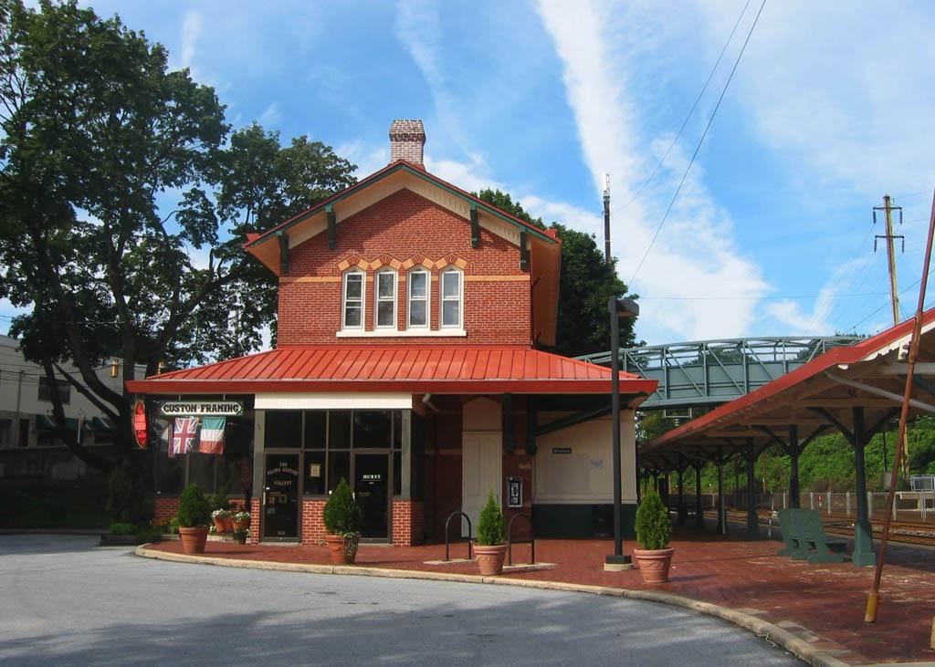 A brick framing shop attached to a train station.