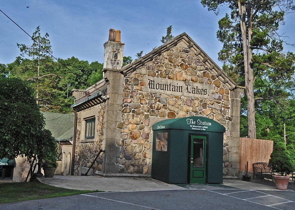 An old stone building with a green entrance.