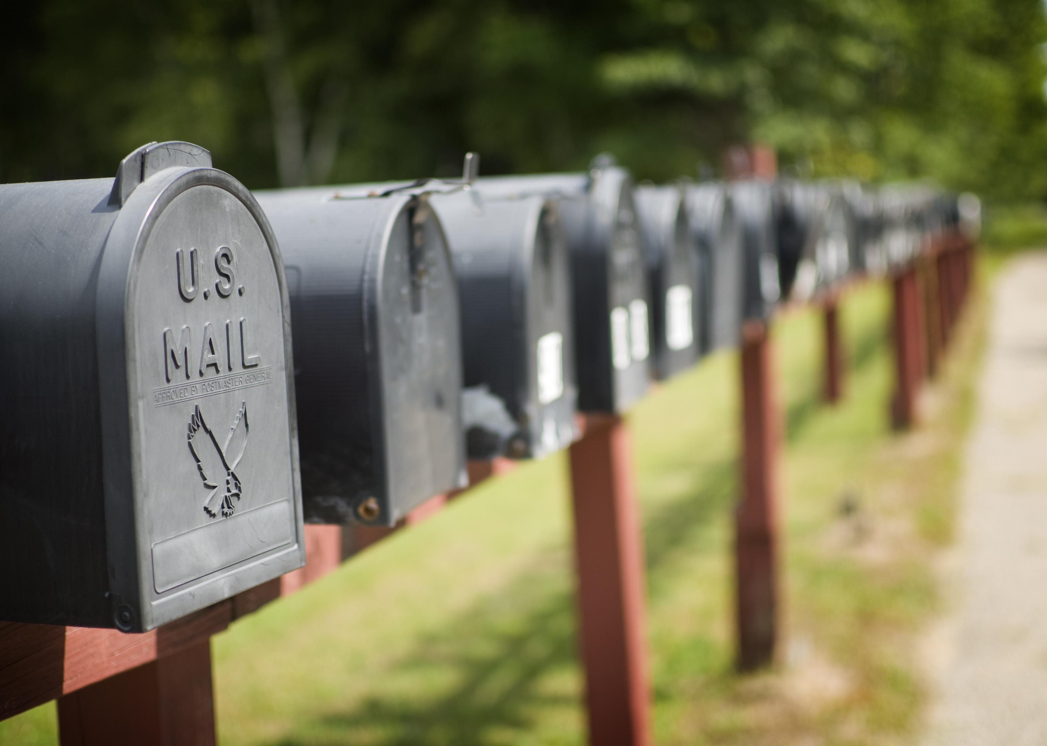 A row of black mailboxes.