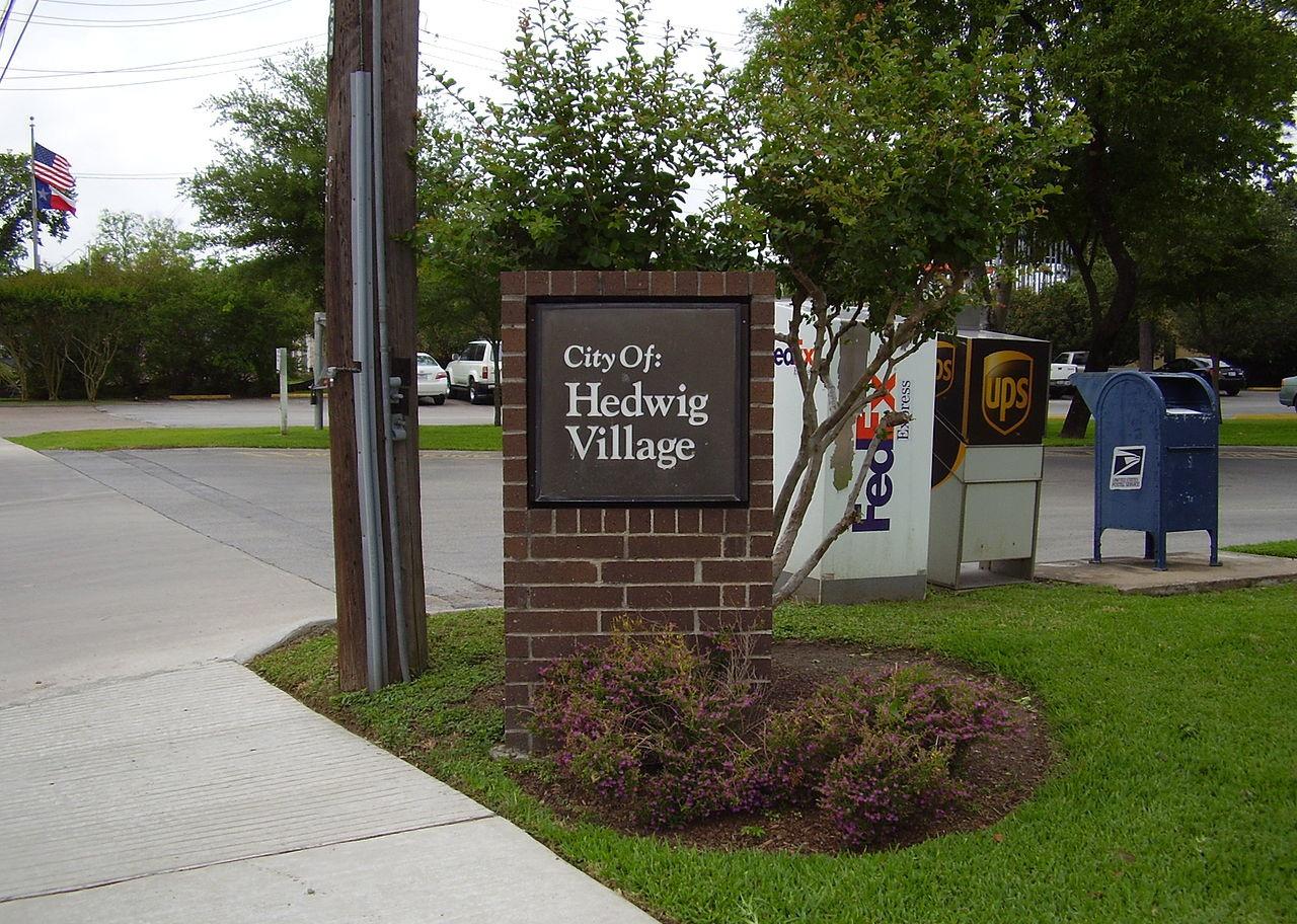 A brick Hedwig Village sign.