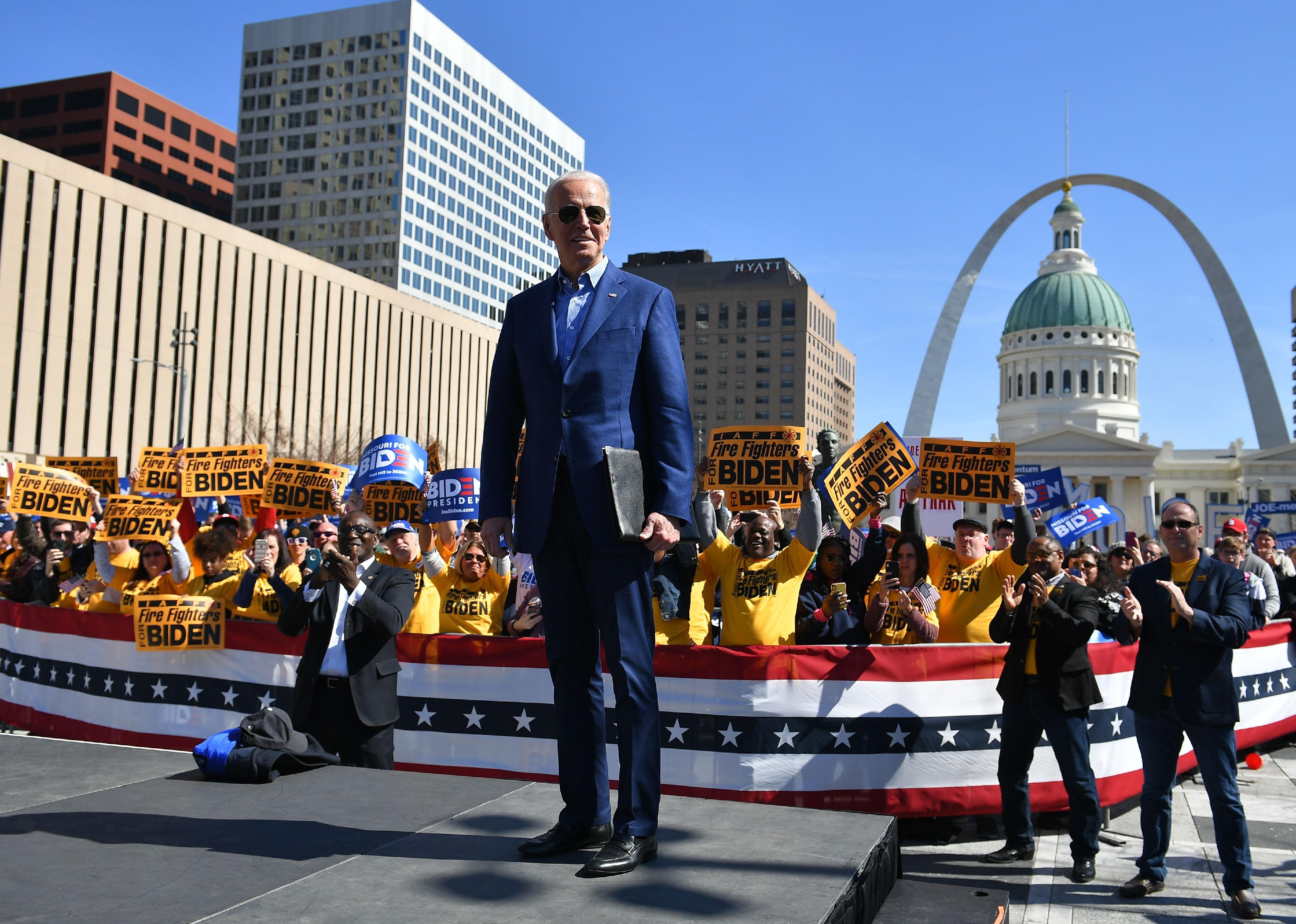 Biden onstage in front of a crowd of firefighters in St. Louis, MO.