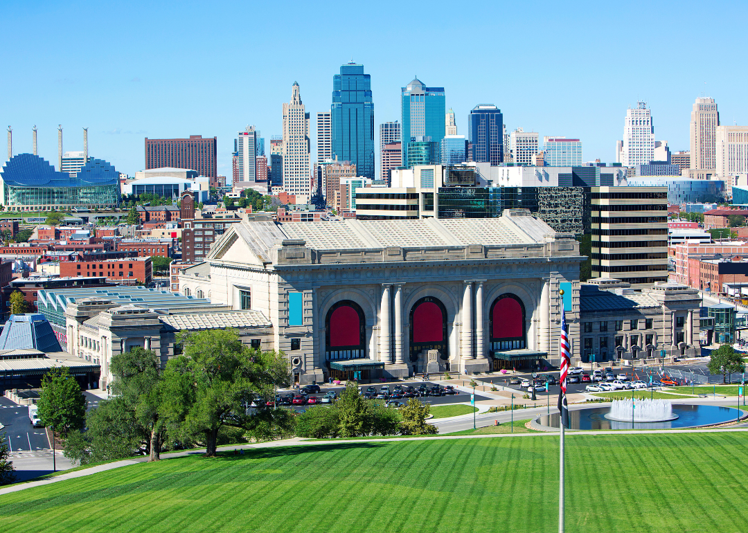 Kansas City, MO skyline with a green mowed field in front.