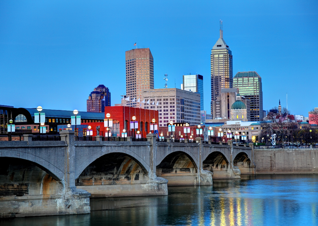 Indianapolis, IN bridge and skyline at twilight.