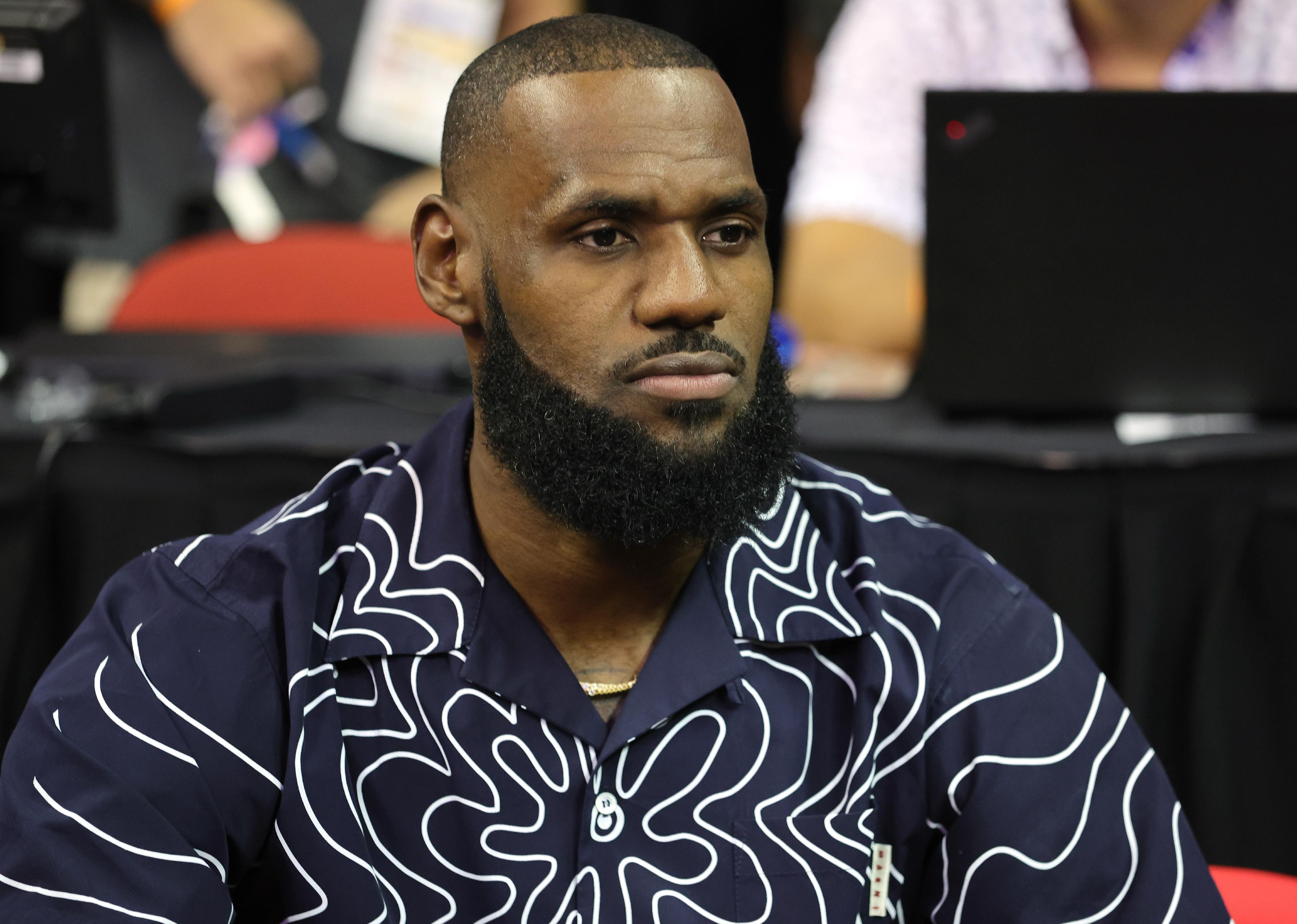 LeBron James in a blue and white shirt.