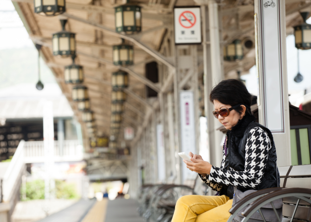 A woman waiting for a train in Japan.