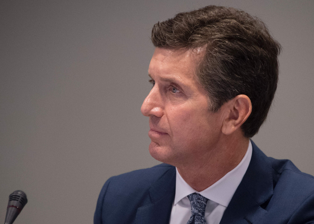 Alex Gorsky with a microphone in front of him.