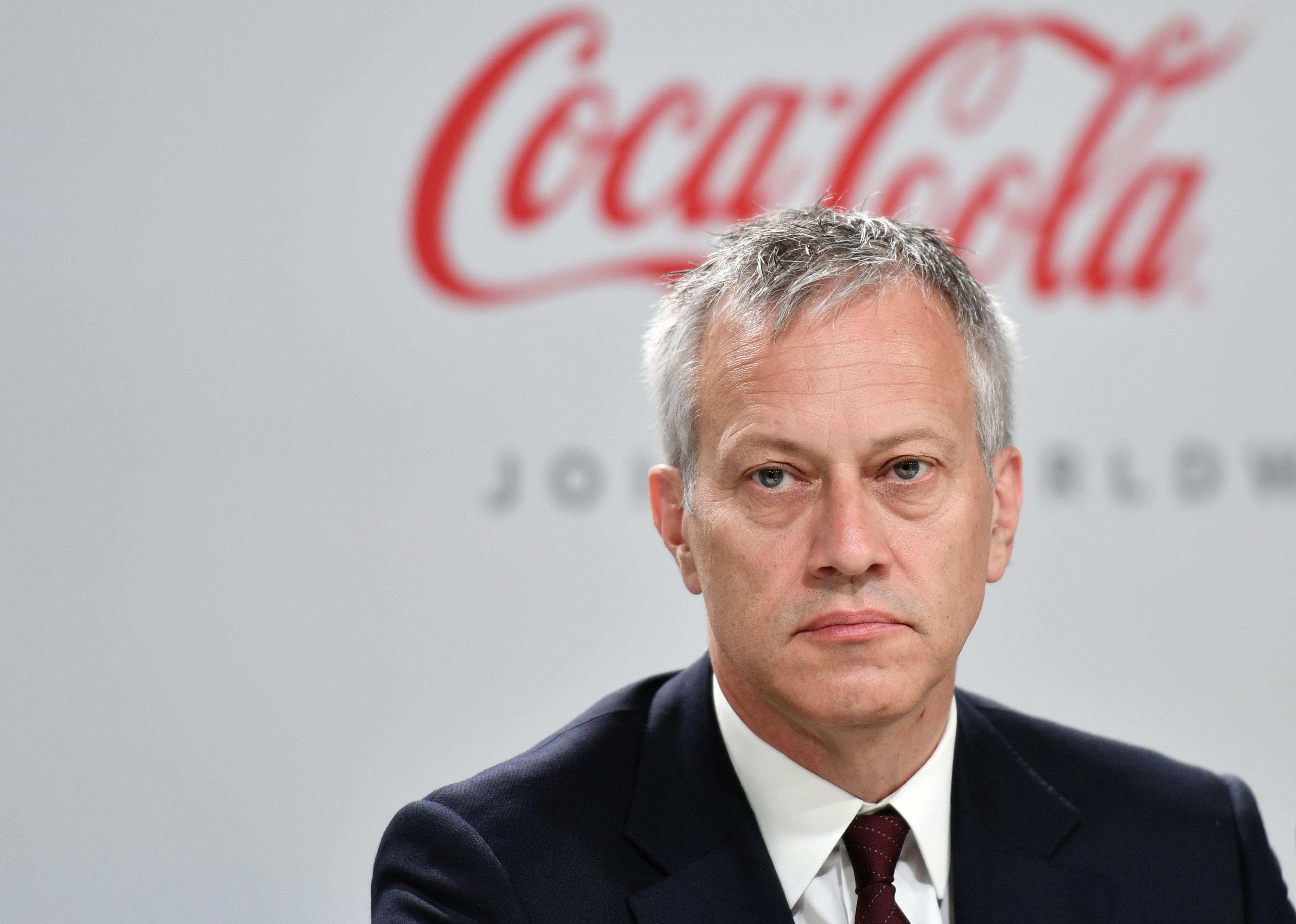 James Quincey in front of a Coca-Cola background.