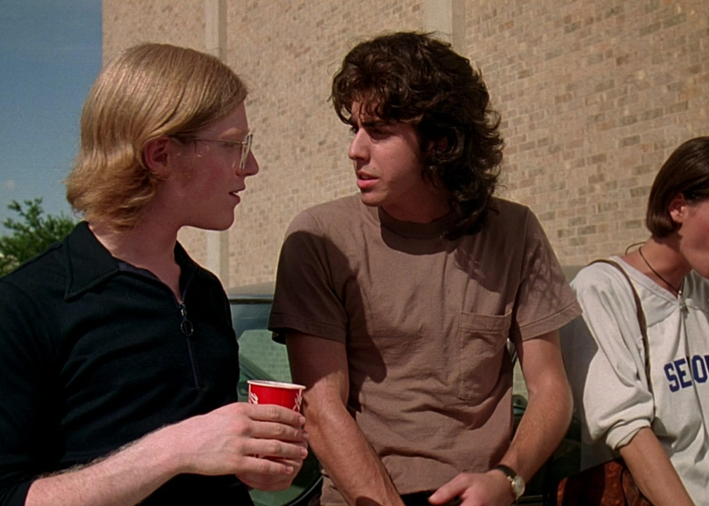 Anthony Rapp and Adam Goldberg talking outside in a scene from Dazed and Confused.