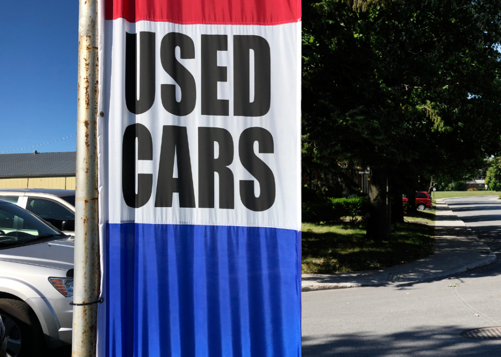 Red, white and blue used cars sign.