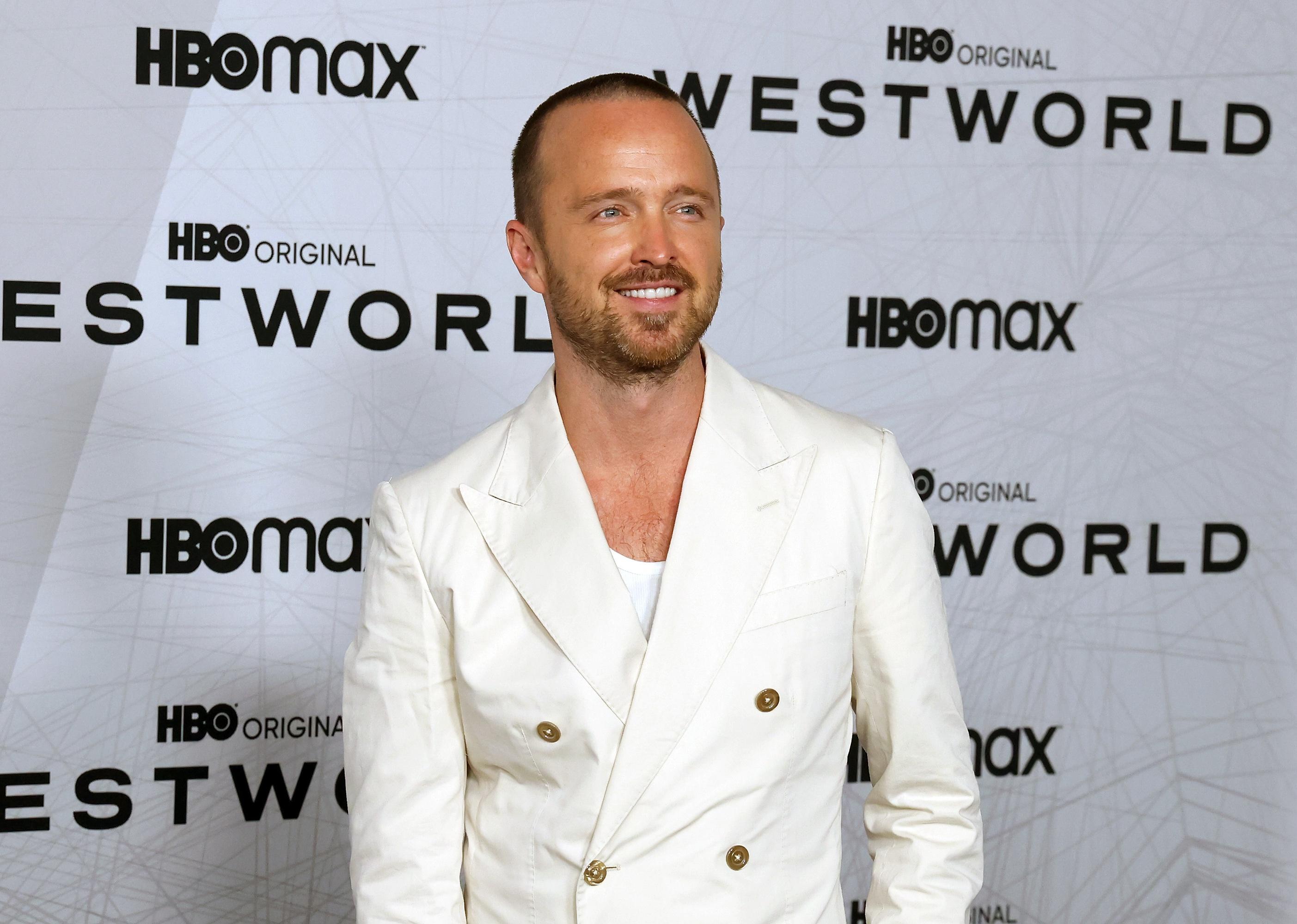 Aaron Paul in a white suit.