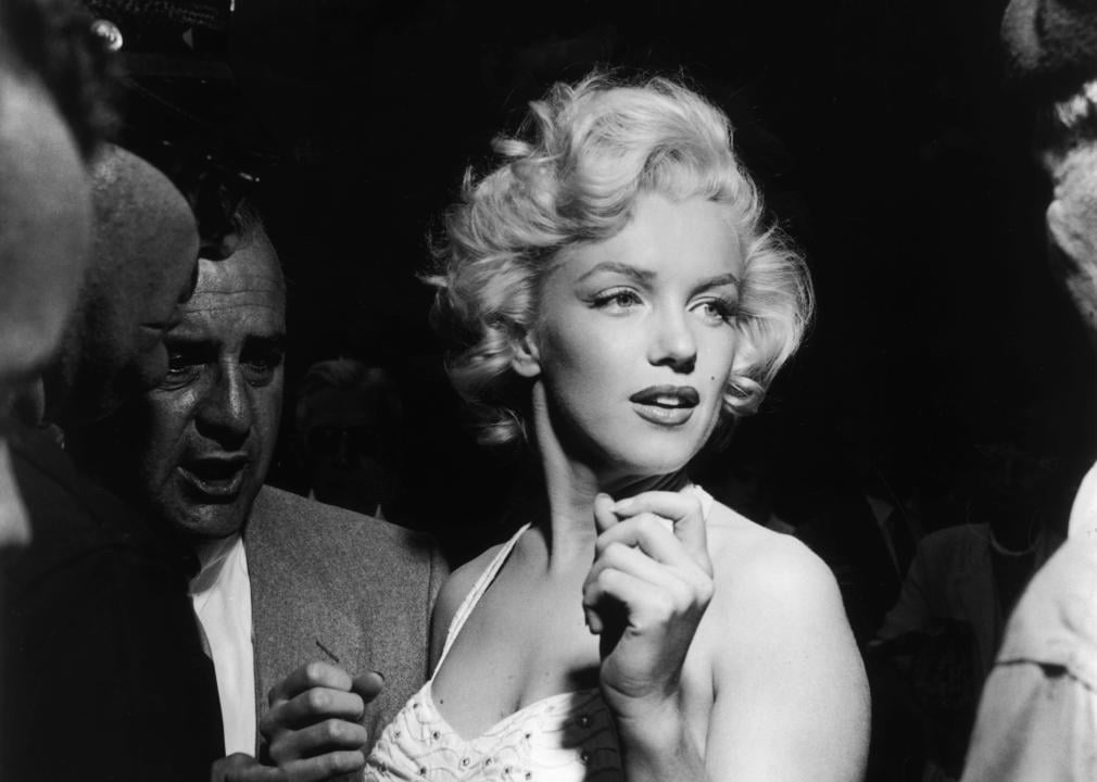 Marilyn Monroe in a black and white image.