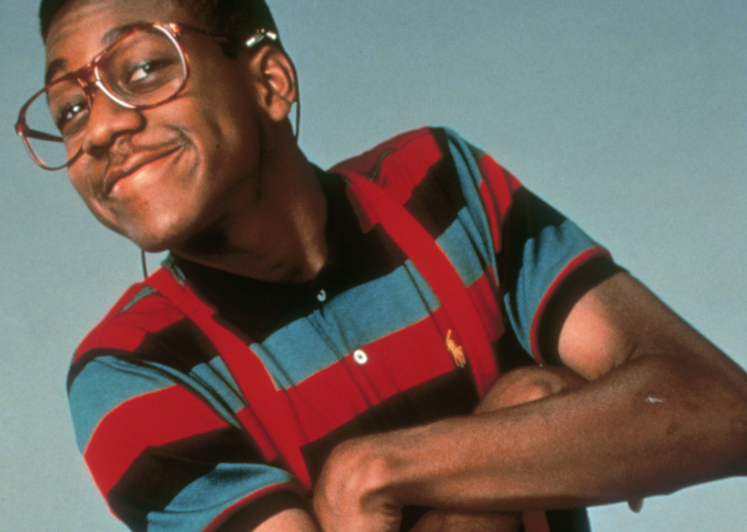 Jaleel White posing as the character Steve Urkel.