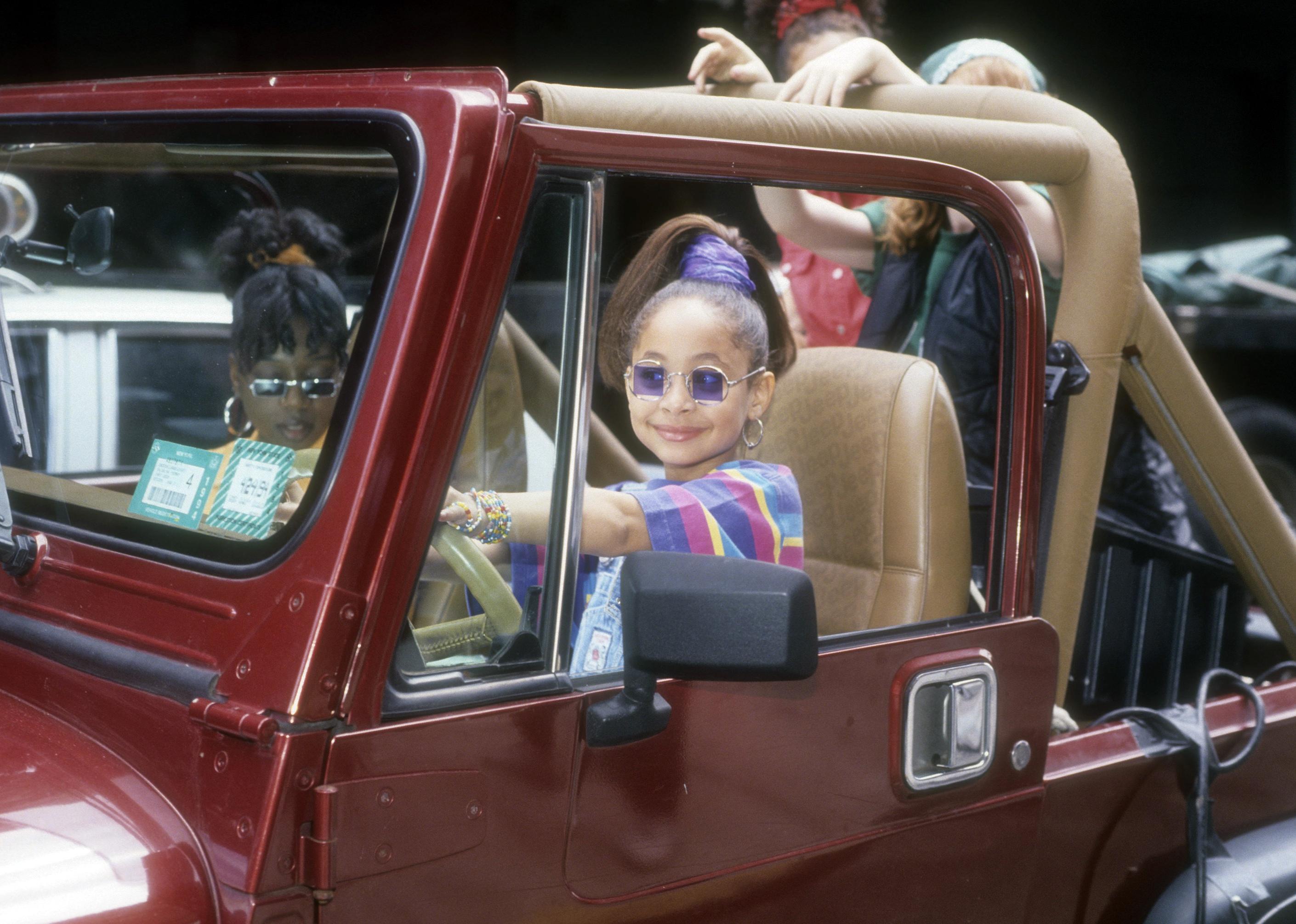 Young Raven-Symoné in a jeep.