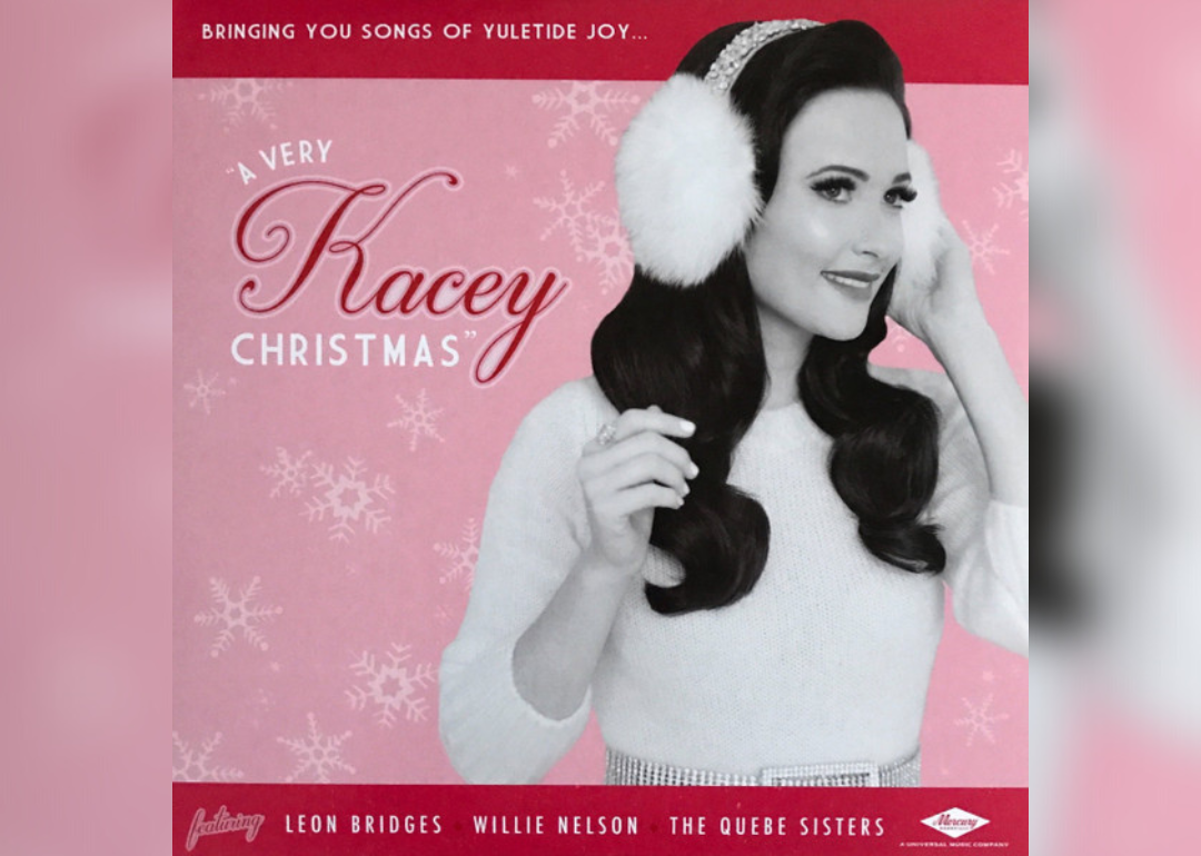 Kacey Musgraves, in black and white and wearing furry ear muffs, on a pink and red album cover.
