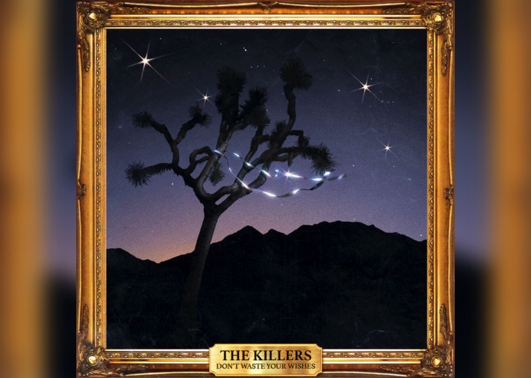 The album cover features a gold-framed piece of art of a tree in the desert at night with a sparkly ribbon.