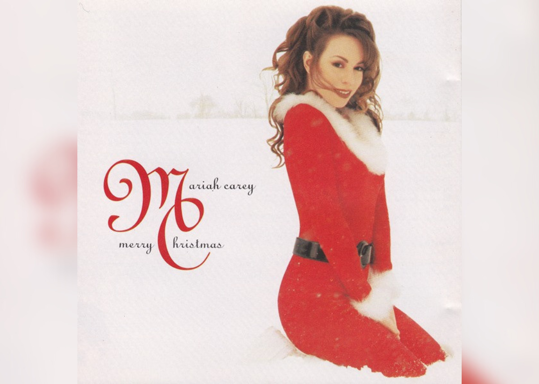 Mariah Carey in a red Christmas suit on the album cover.