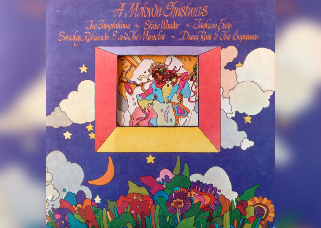 The album cover features a colorful abstract art piece with an angel playing a horn in the center and the sun and flowers on the outside.