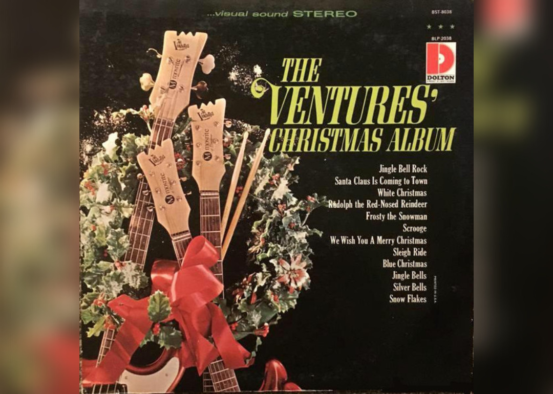 Guitars propped up with bows and a wreath around them on the album cover.