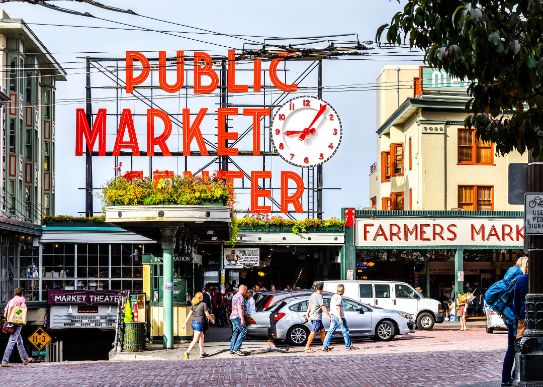 People walking at a downtown public market.