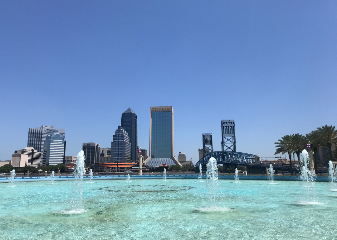A water fountain with downtown Jacksonville in the background.