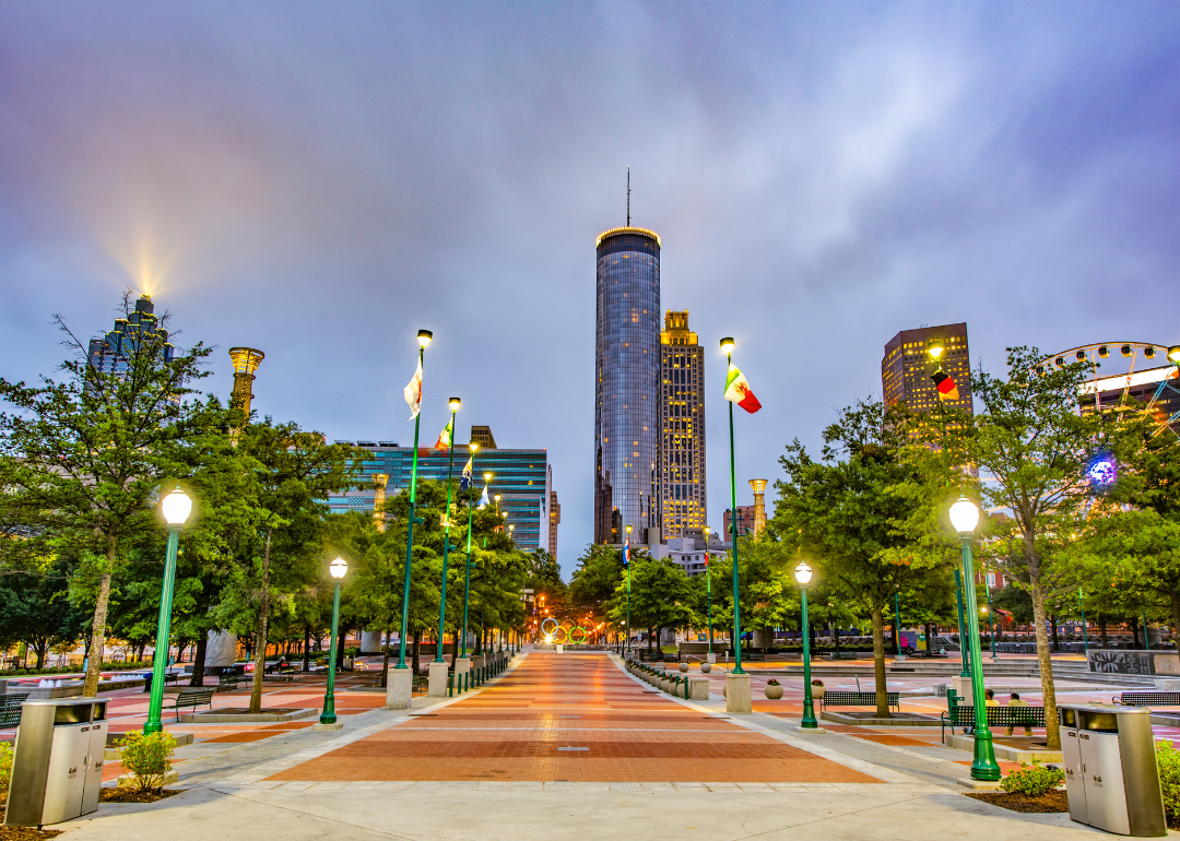 A downtown park with skyscrapers in the background.